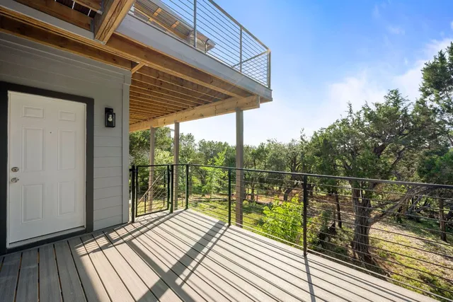 a view of a balcony with wooden floor