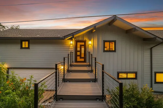a front view of a house with stairs
