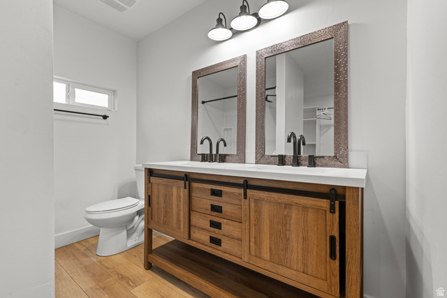 2101 West 3900th Street South Roy, UT 84067 - Photo 13 of 36 Double vanity with a white countertop and two vessel sinks, complemented by matte black faucets