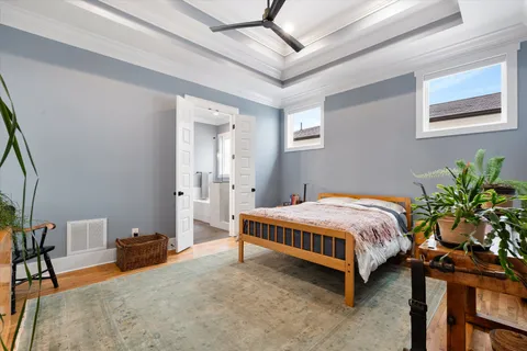 a bedroom with a bed and a table