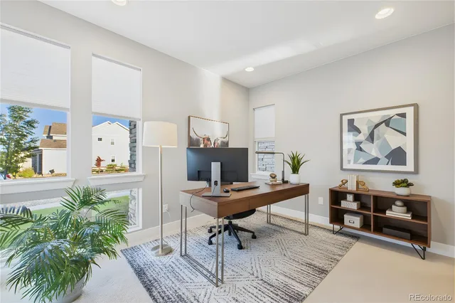 a view of a workspace with furniture and a couch