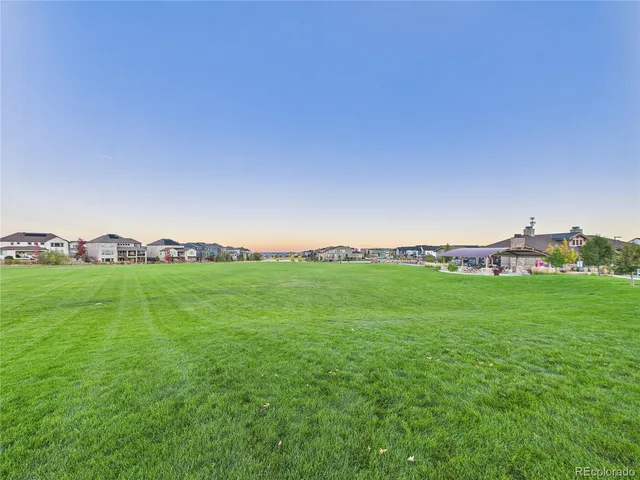 a view of a golf course with a lake view
