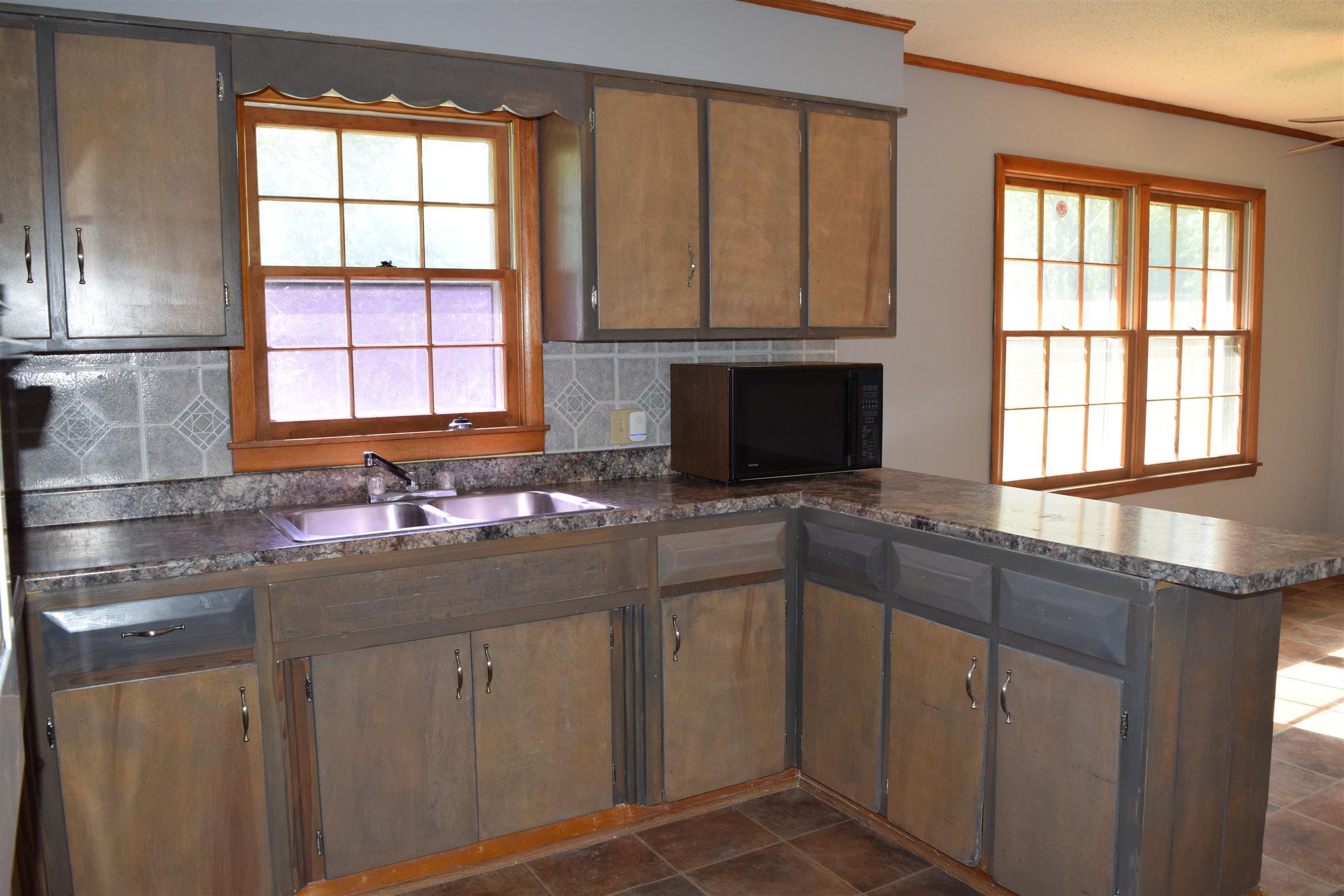 100 Towering Oaks Road Tennessee Ridge, TN 37178 - Photo 11 of 16 a kitchen with a sink stove and cabinets