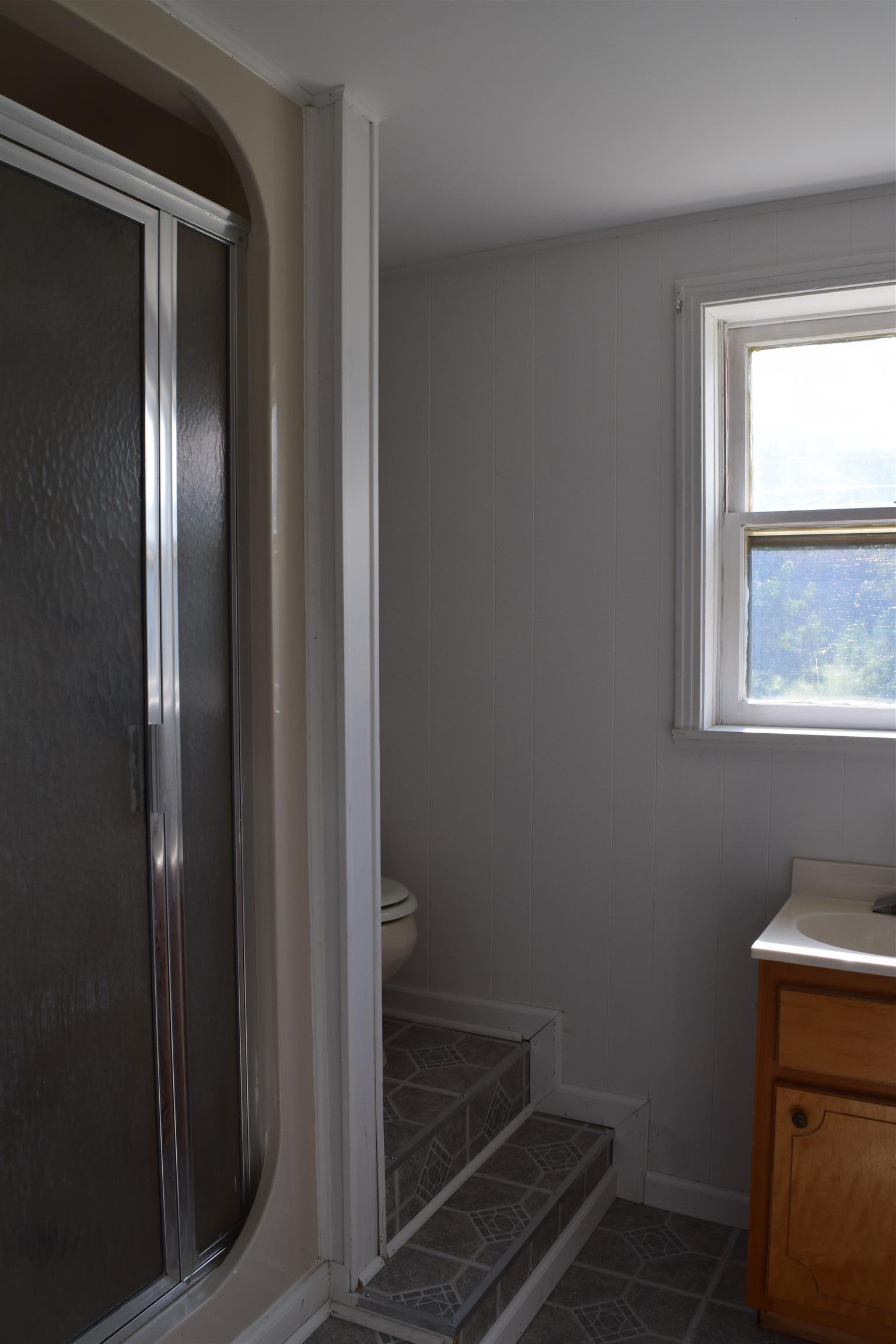 100 Towering Oaks Road Tennessee Ridge, TN 37178 - Photo 13 of 16 a bathroom with a mirror