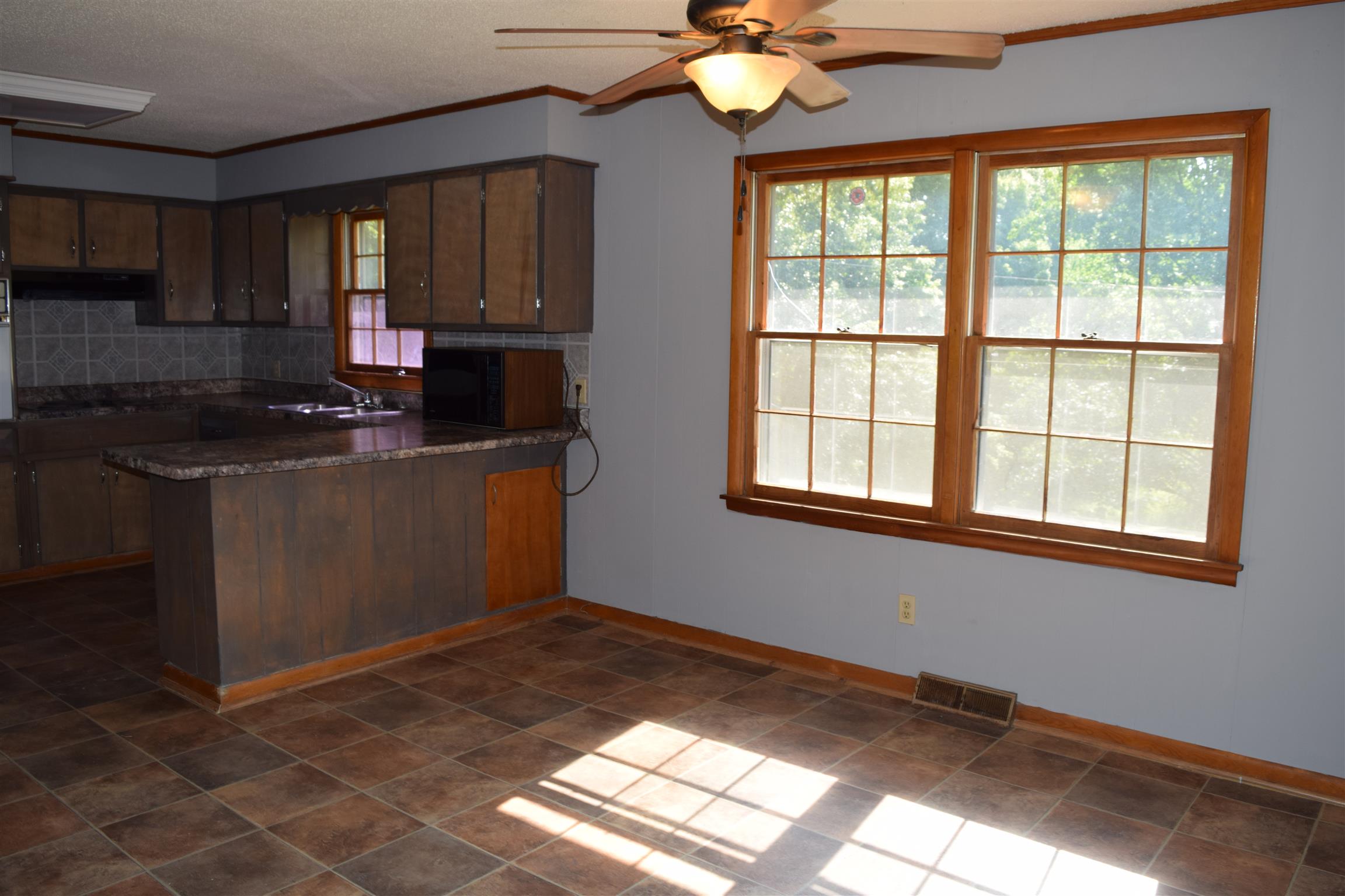 100 Towering Oaks Road Tennessee Ridge, TN 37178 - Photo 9 of 16 a kitchen with stainless steel appliances granite countertop a sink stove and refrigerator