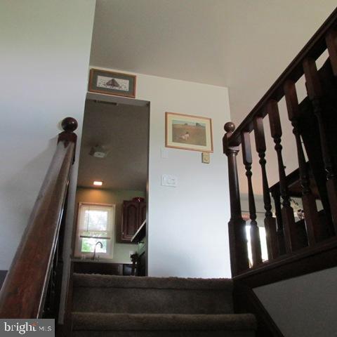 385 West Ridge Road Elizabethtown, PA 17022 - Photo 4 of 33 a view of staircase with lots of frames on wall and glass door