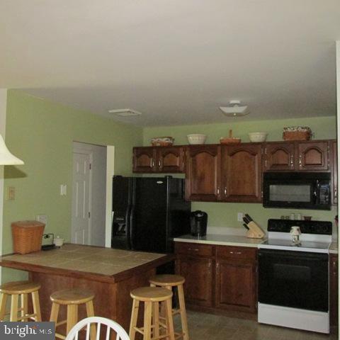 385 West Ridge Road Elizabethtown, PA 17022 - Photo 10 of 33 a kitchen with stainless steel appliances granite countertop a refrigerator and a stove top oven