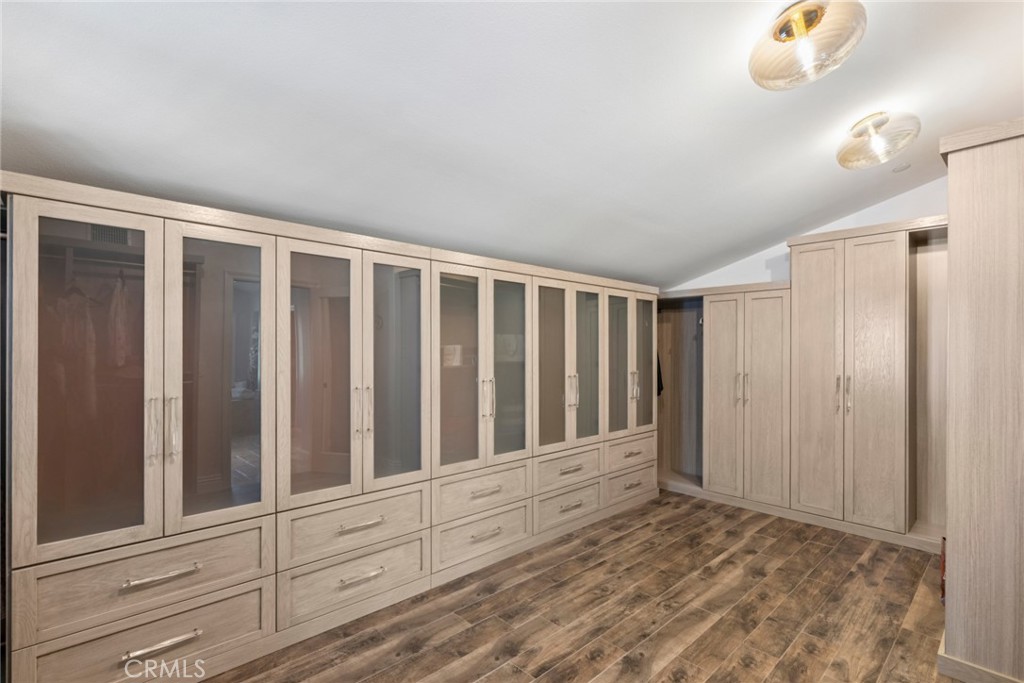 2 Ali Lane Ladera Ranch, CA 92694 - Photo 36 of 75 Huge primary walk in closet with custom cabinets and flooring