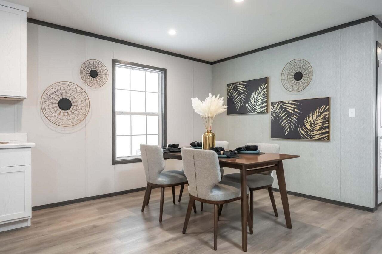 19520 260th Street Okeechobee, FL 34972 - Photo 4 of 17 a dining room with wooden floor and a window