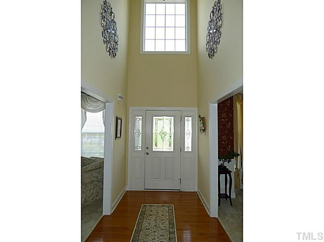 316 Powers Ferry Road Cary, NC 27519 - Photo 13 of 25 The two-story foyer offers a spectacular entrance for guests and homeowners alike. It is brightly lit by natural light and is has like new hardwood flooring. Foyer