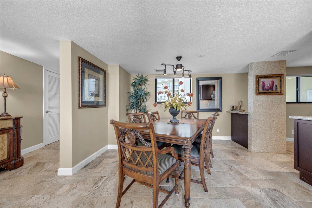 200 Ocean Trail Way, Unit 108 Jupiter, FL 33477 - Photo 13 of 38 a view of a dining room with furniture