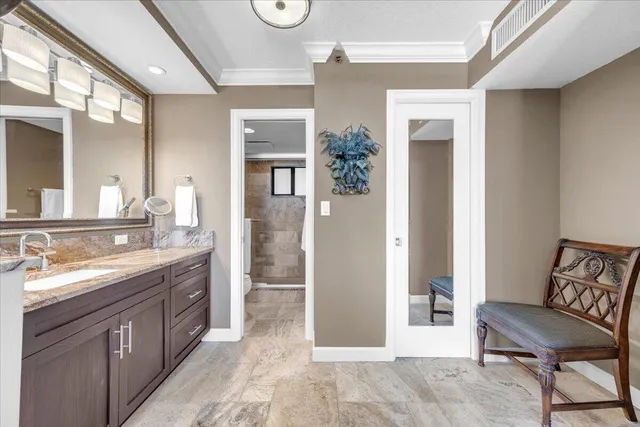 a spacious bathroom with a double vanity sink and a mirror