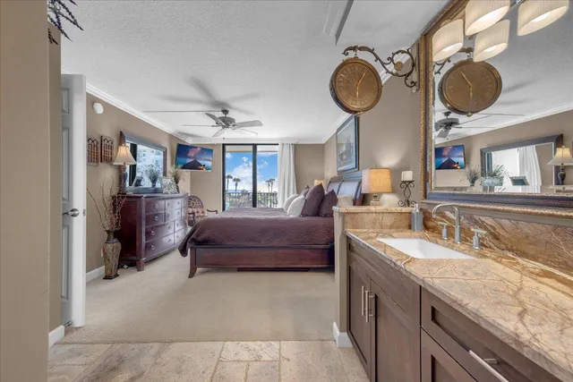 a living room with furniture a chandelier fan and a window