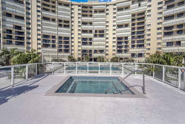 a view of a swimming pool with a chair