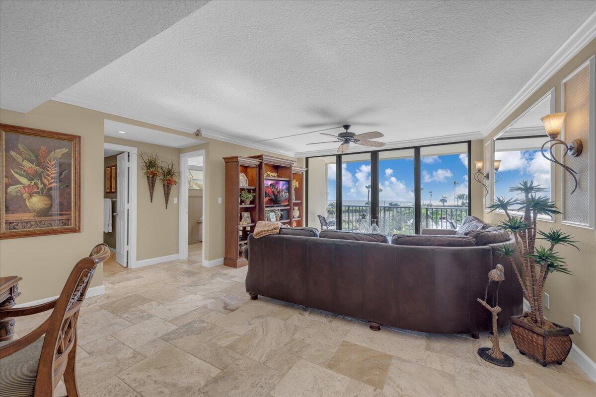 200 Ocean Trail Way, Unit 108 Jupiter, FL 33477 - Photo 9 of 38 a living room with furniture and a large window