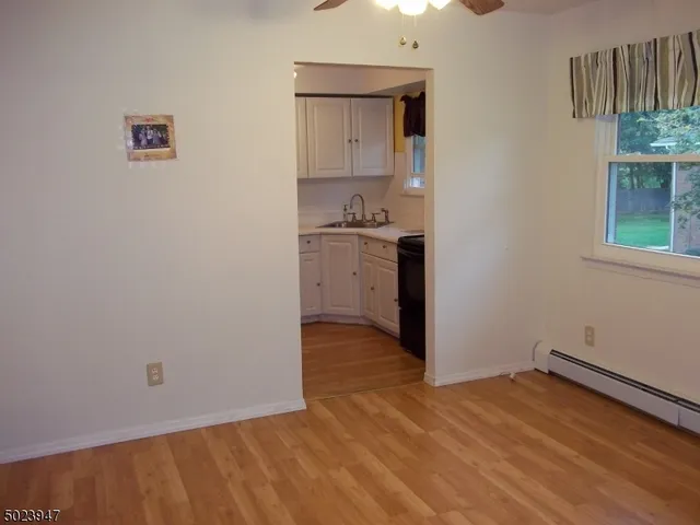 a kitchen with a refrigerator and a stove