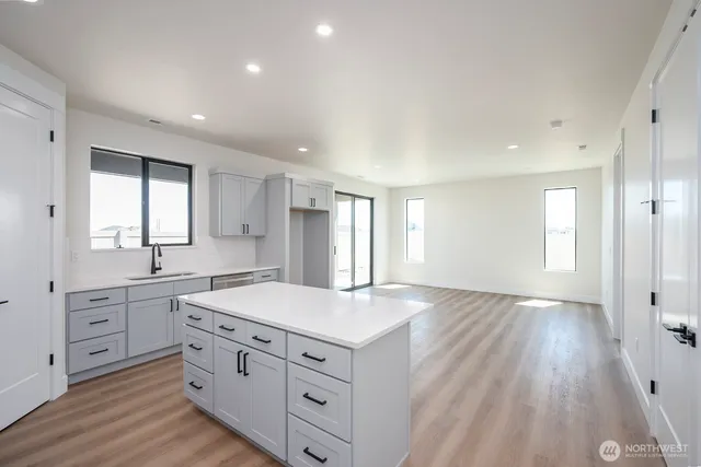 an empty room with wooden floor