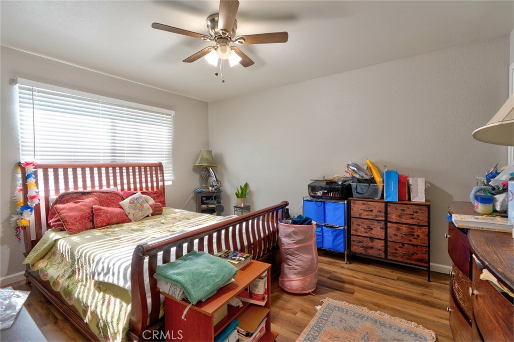 1840 Cheyenne Drive Merced, CA 95348 - Photo 43 of 90 a bedroom with a bed and a chandelier