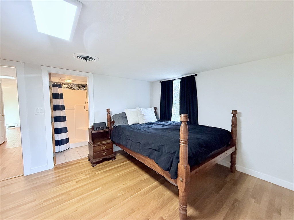 975 South Main Street Bellingham, MA 02019 - Photo 18 of 38 a living room with furniture and wooden floor