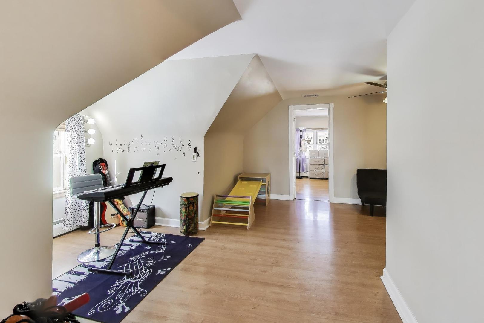 29 Iowa Avenue Addison, IL 60101 - Photo 15 of 31 a living room with furniture and a table