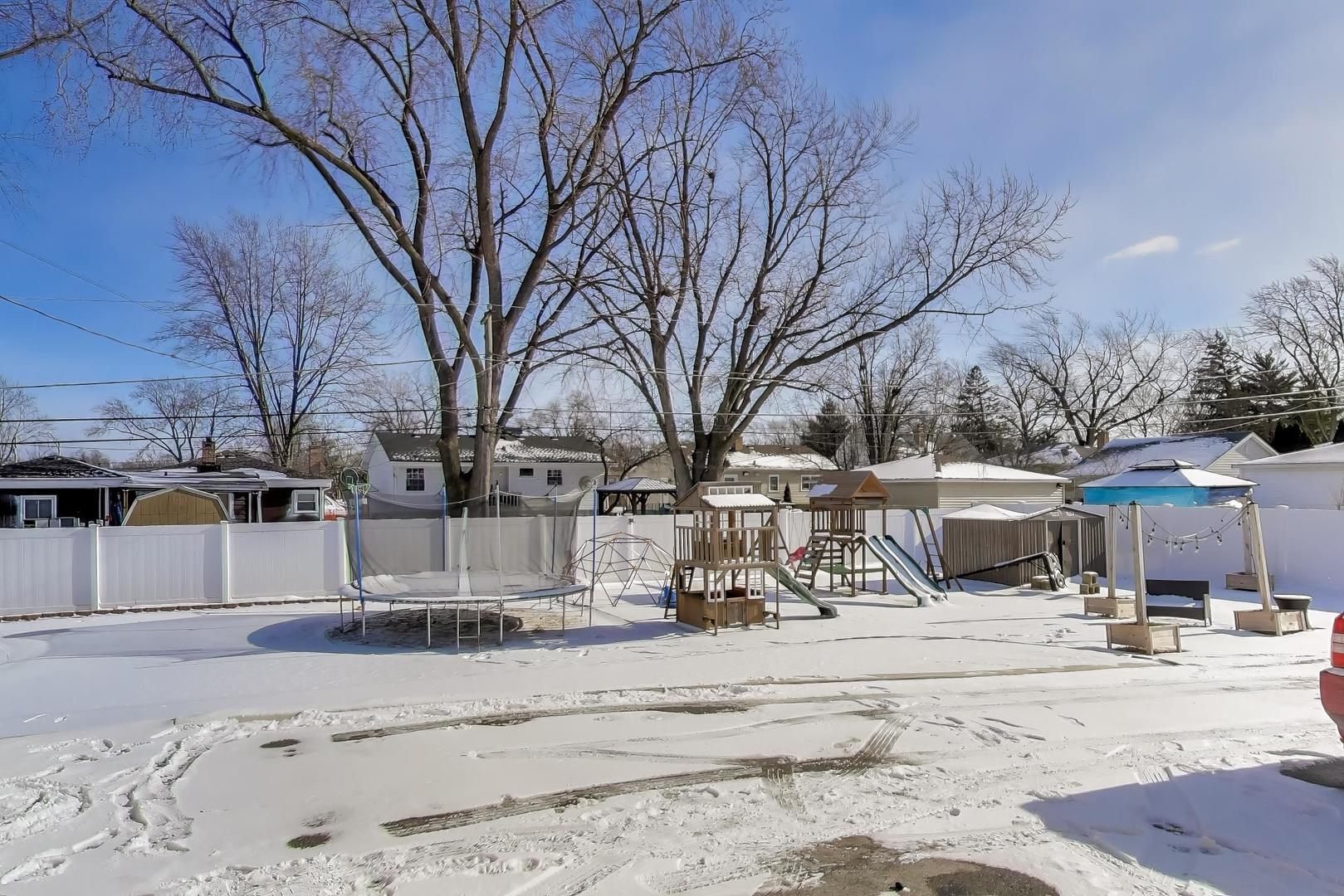 29 Iowa Avenue Addison, IL 60101 - Photo 28 of 31 a view of a building with snow on the road