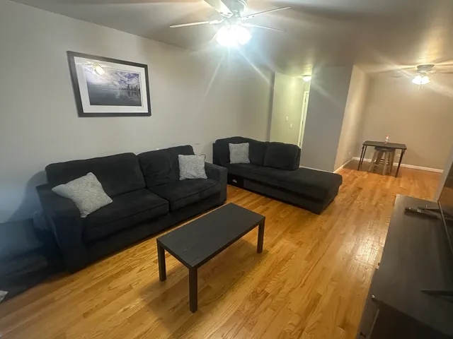 a living room with furniture and a rug