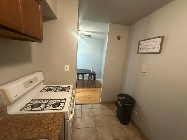 a kitchen with a stove and a refrigerator