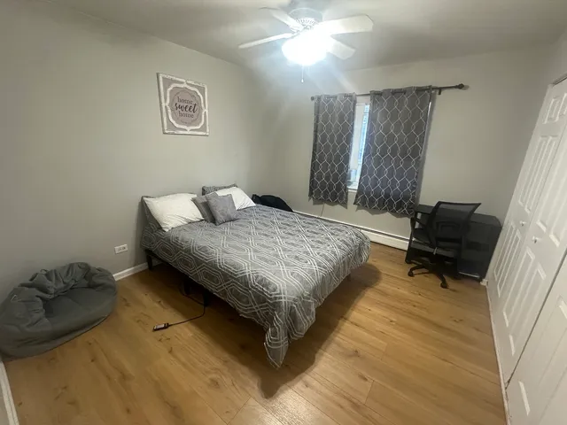 a bedroom with a bed and a couch