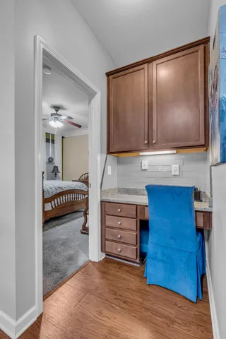 a view of room with cabinet and flat screen tv