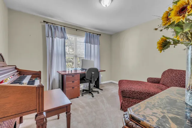 a workspace with furniture and a window