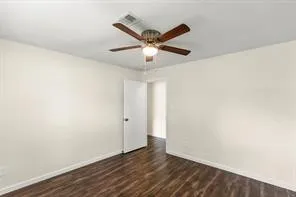 a view of a ceiling fan with wooden floor