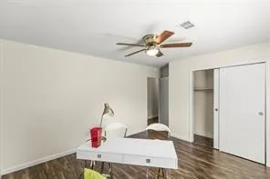 a view of a room with toys and wooden floor