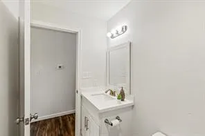 a bathroom with a sink a mirror and a window