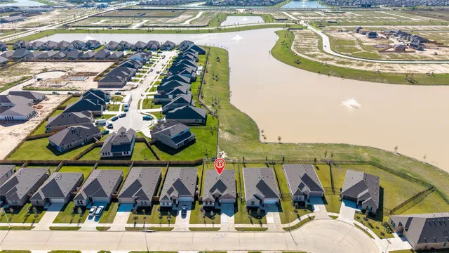 a view of swimming pool with a table and chairs