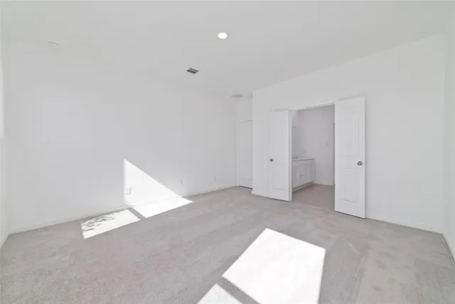 a bathroom with double sink and a mirror