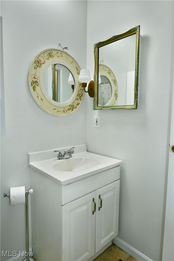 234 Howland Wilson Road Northeast Warren, OH 44484 - Photo 16 of 37 Bathroom featuring vanity and tile patterned floors