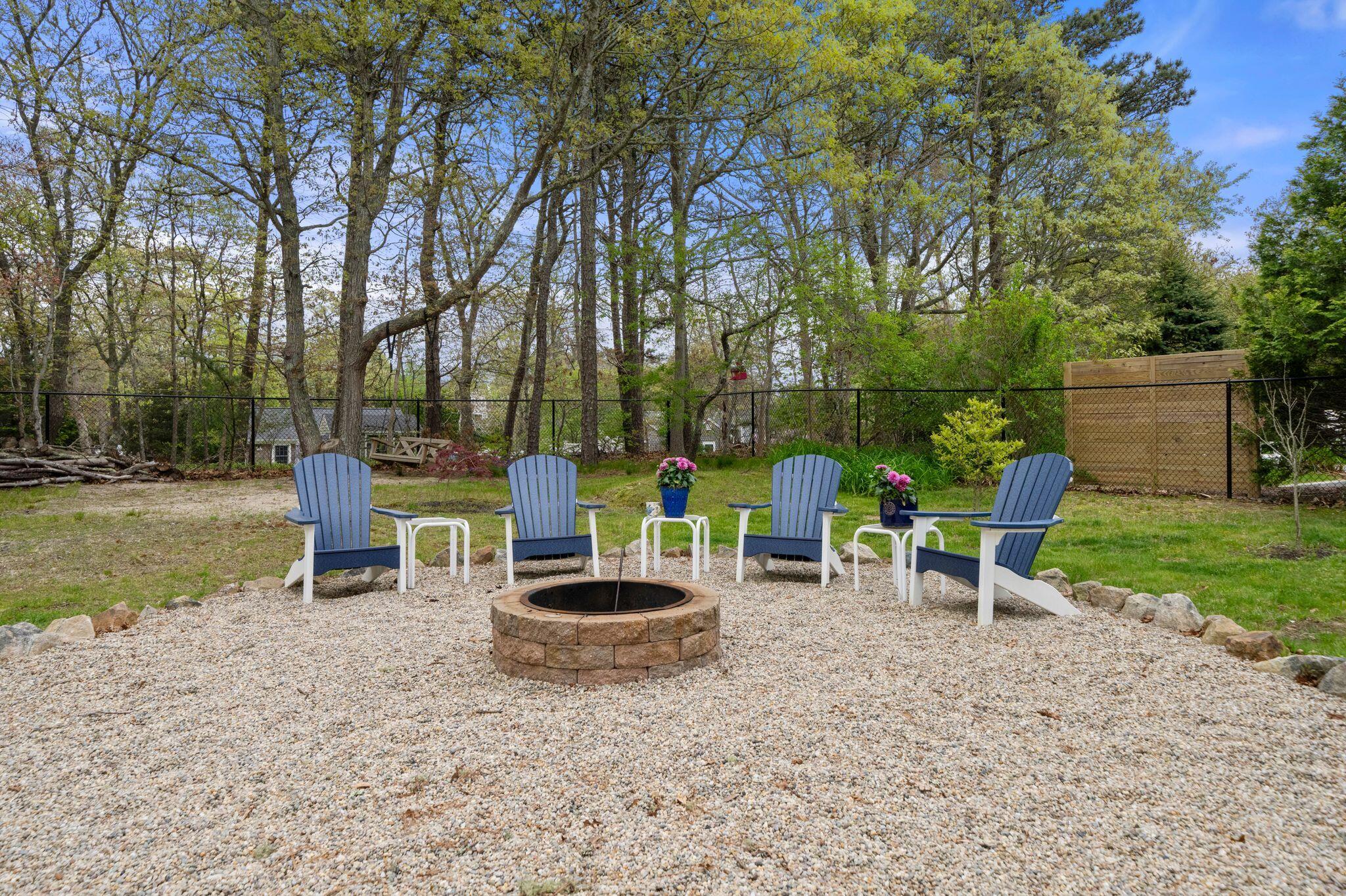 40 Sam Ryder Road Chatham, MA 02633 - Photo 5 of 42 a table and chairs in the garden