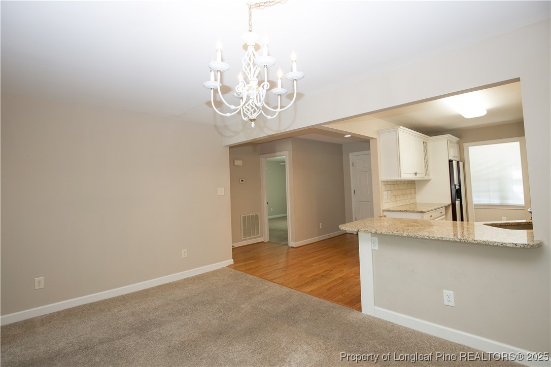 175 Knoll Road Southern Pines, NC 28387 - Photo 15 of 50 a view of a chandelier in a room