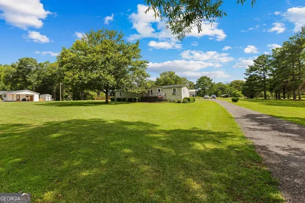 a view of a garden with an outdoor space