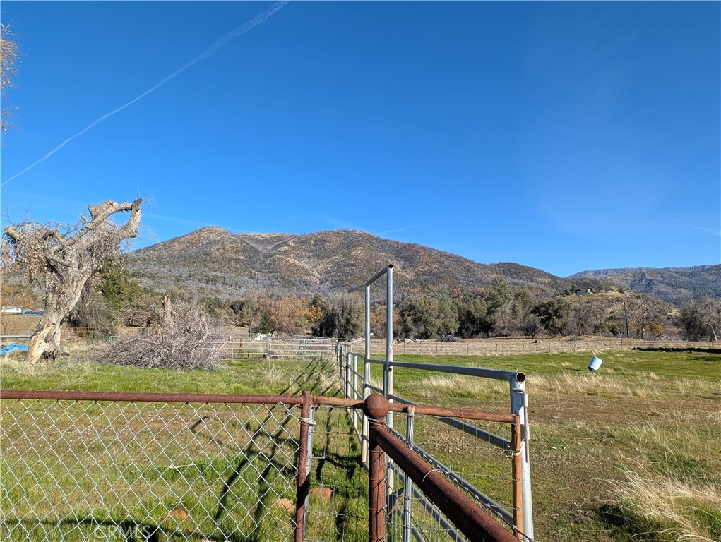 4103 Triangle Road Mariposa, CA 95338 - Photo 15 of 39 a view of a lake with a mountain in the background