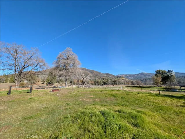 a view of a town with mountains in the background