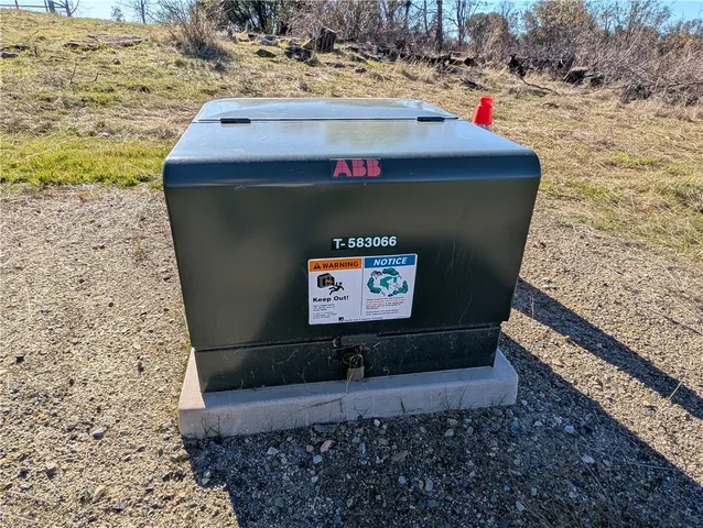 a sign that is sitting on a rock
