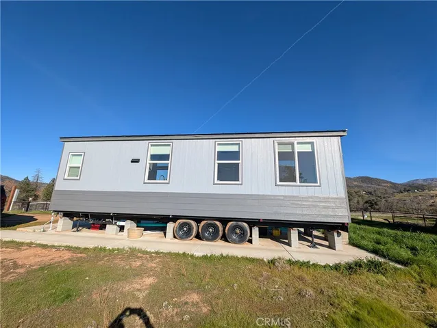 a view of a back yard of the house