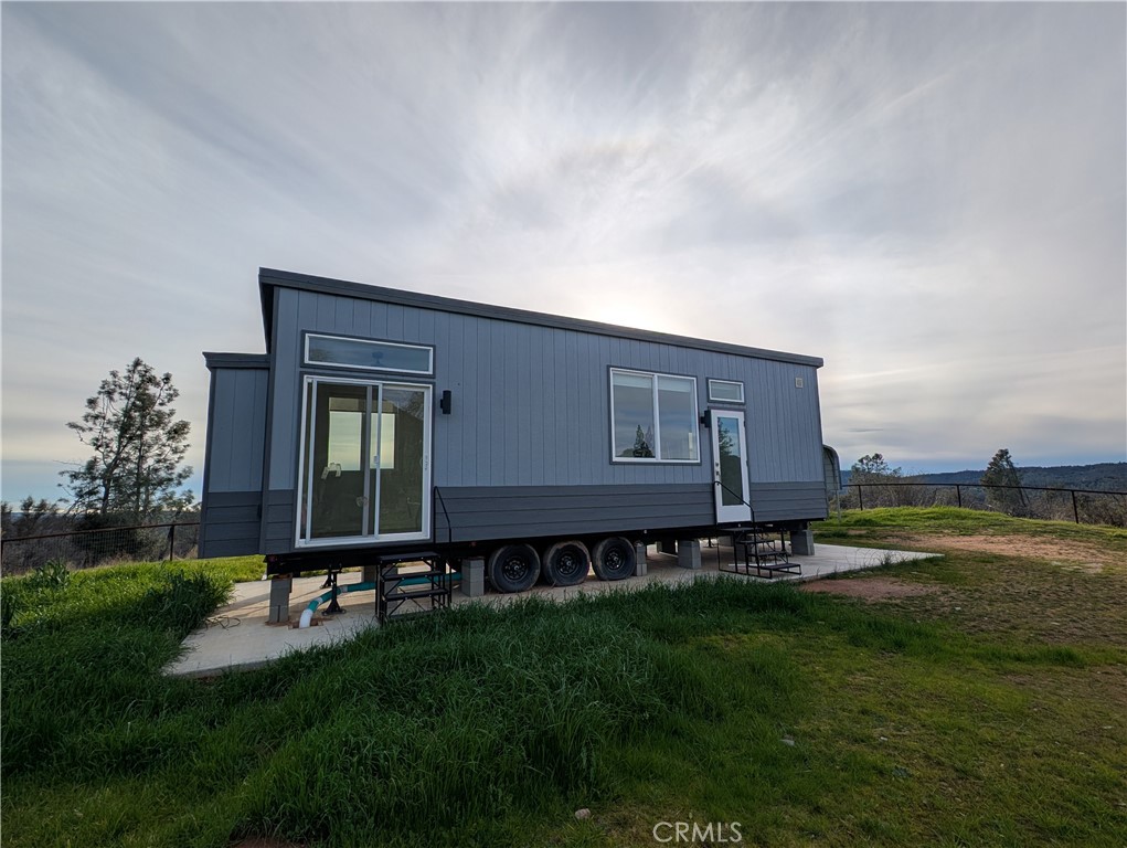 4103 Triangle Road Mariposa, CA 95338 - Photo 32 of 39 a backyard of a house with lots of green space and plants