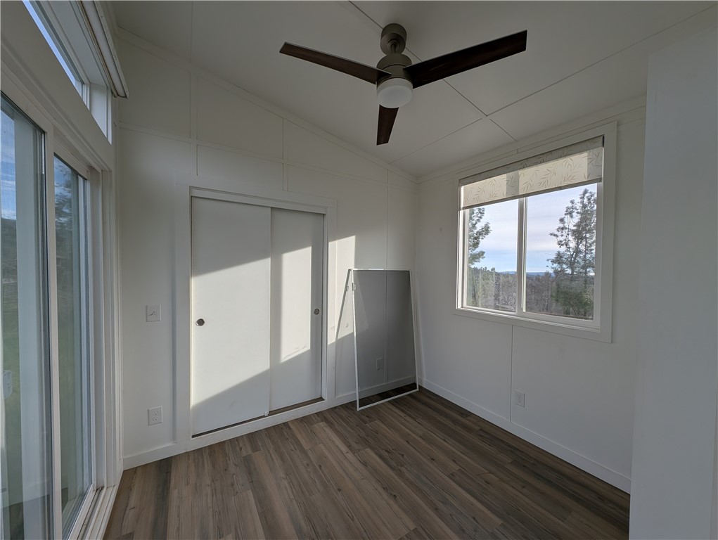 4103 Triangle Road Mariposa, CA 95338 - Photo 37 of 39 a view of an empty room with wooden floor and a window