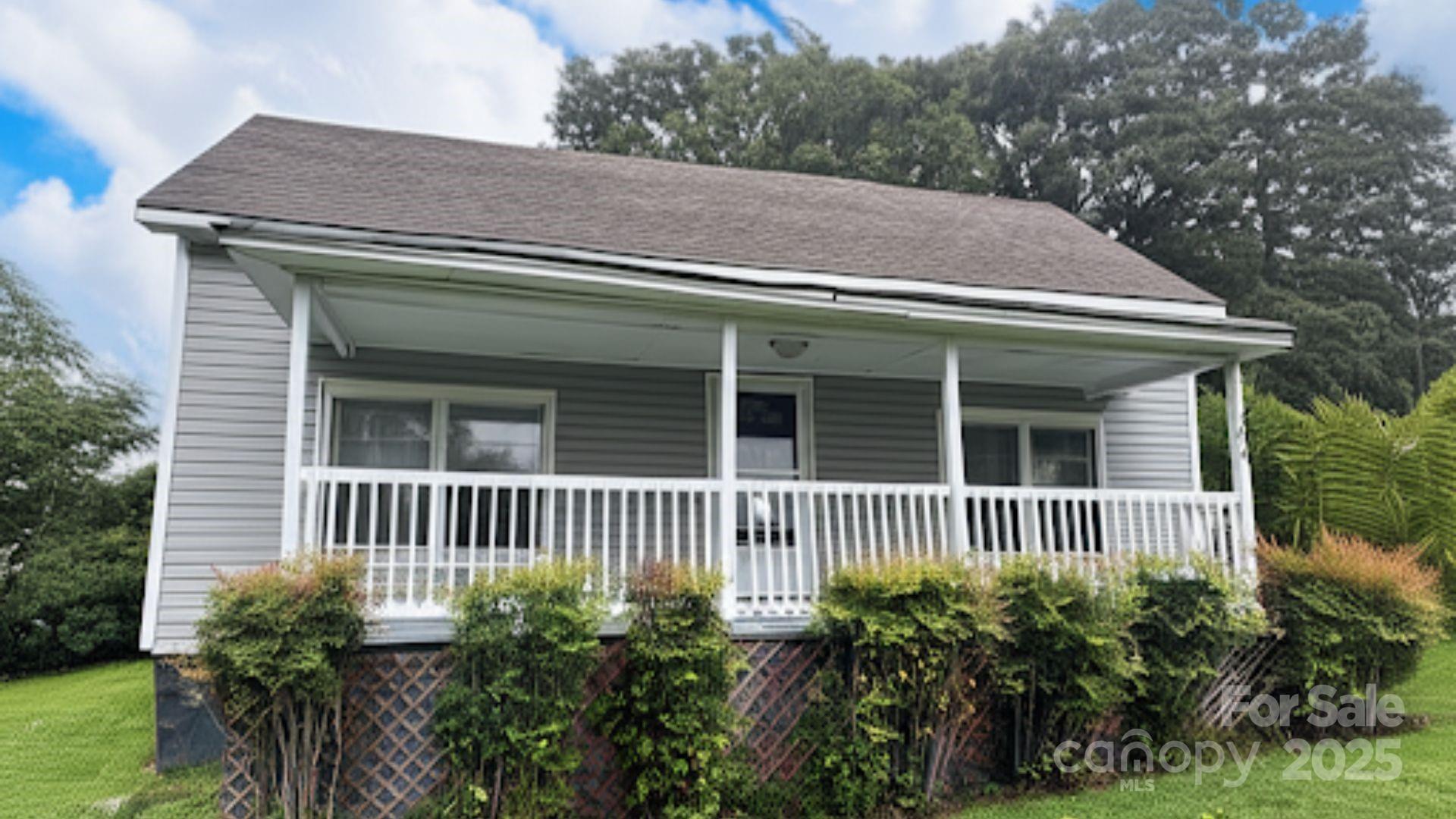 103 Fairview Street Clover, SC 29710 - Photo 2 of 24 a house view with a garden space