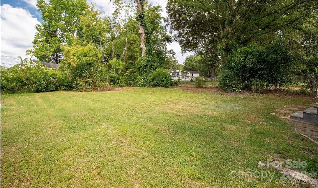 103 Fairview Street Clover, SC 29710 - Photo 23 of 24 a view of yard with swimming pool and trees