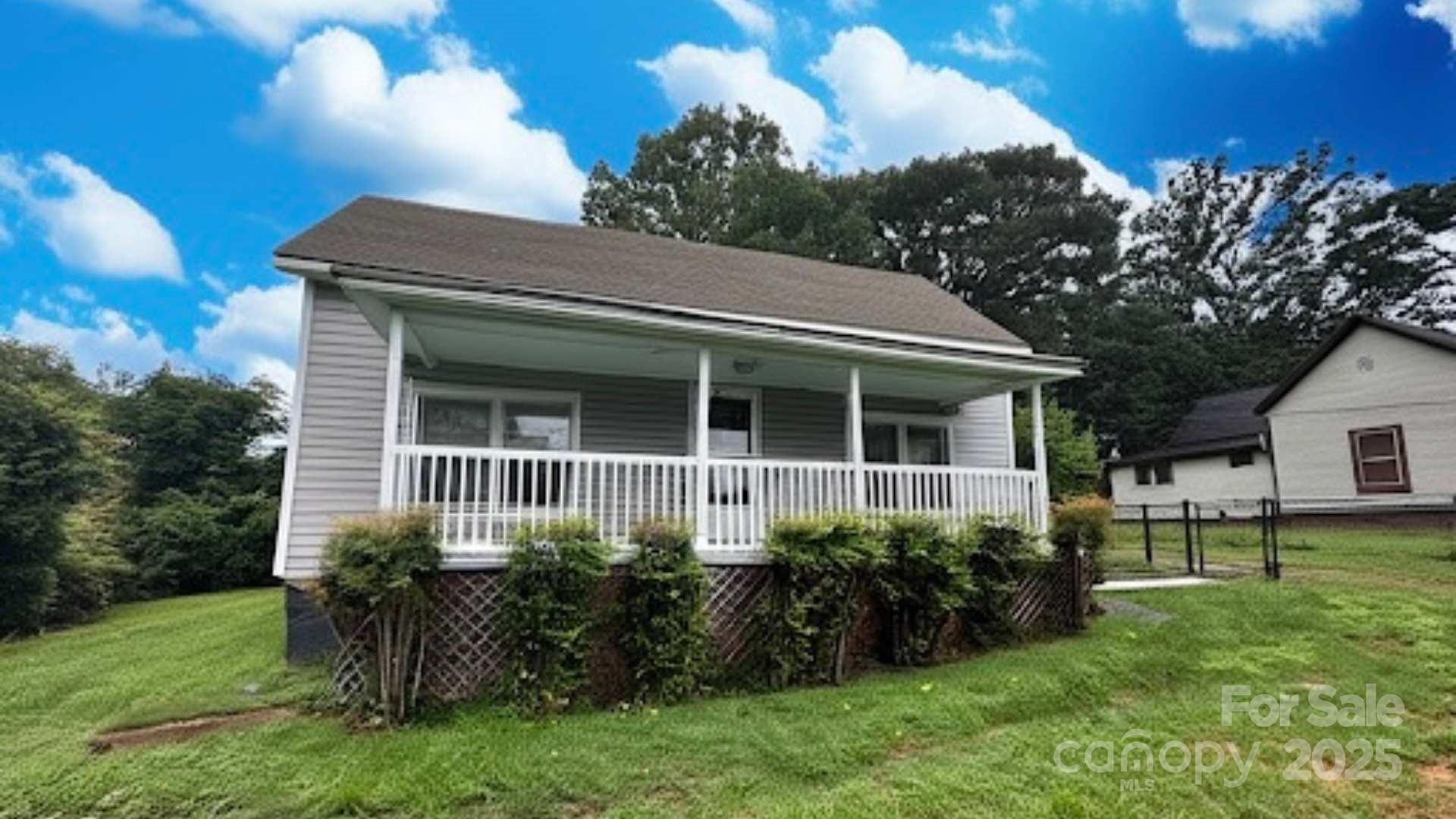 103 Fairview Street Clover, SC 29710 - Photo 3 of 24 a view of house with a yard