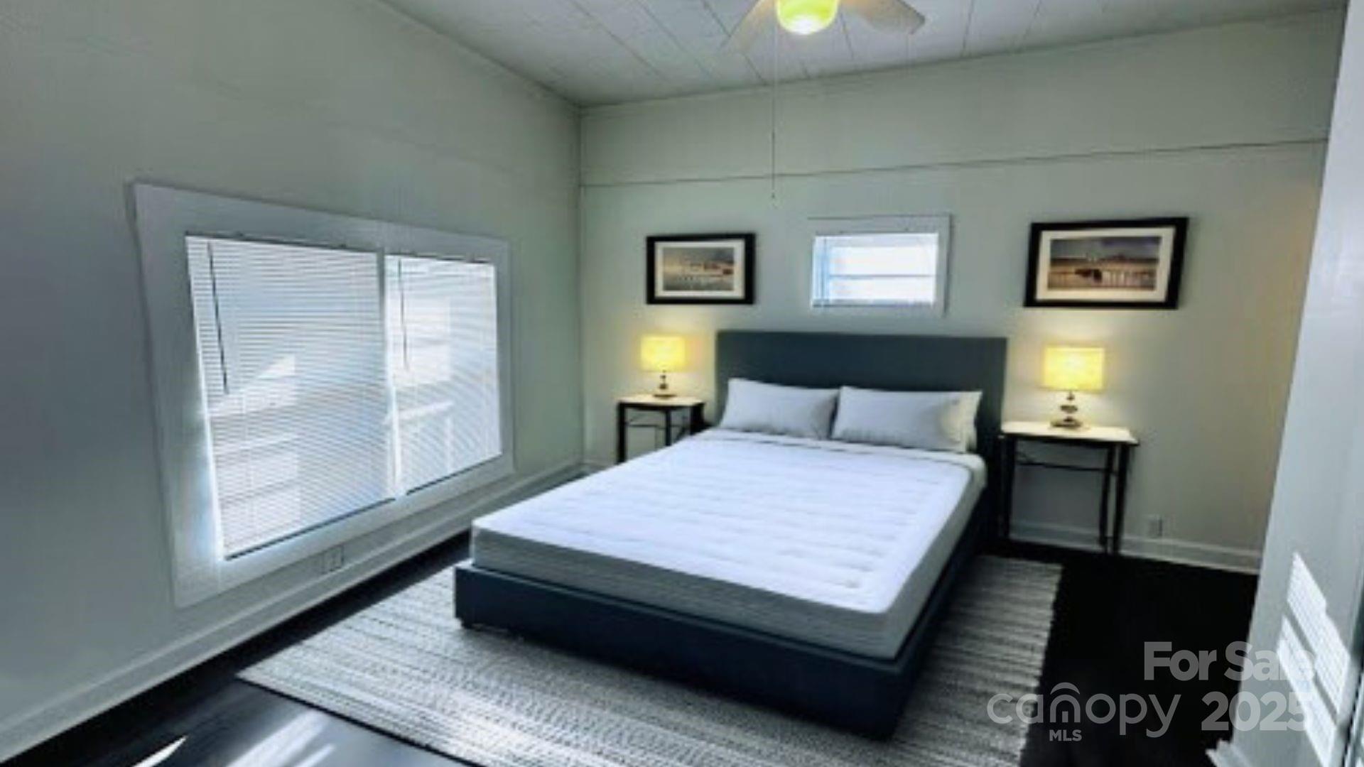 103 Fairview Street Clover, SC 29710 - Photo 10 of 24 a bedroom with a bed window and a night stand