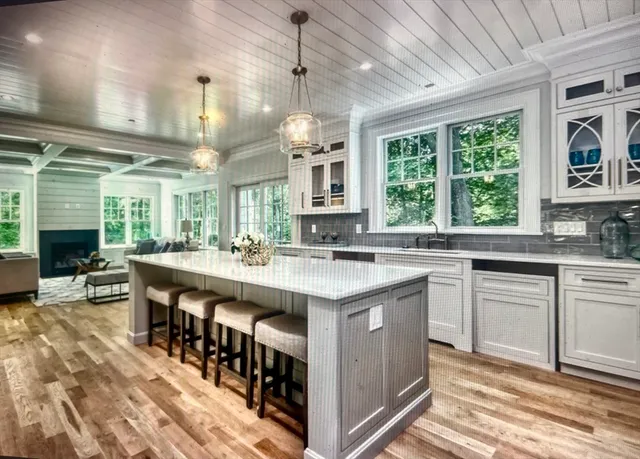 a kitchen with stainless steel appliances granite countertop a stove and a sink
